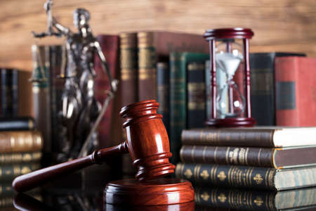 Gavel of the jugde and scale of justice in the court library.