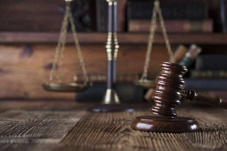 Gavel of the jugde and scale of justice in the court library.の写真素材