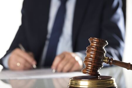 Attorney concept. Legal office. Lawyers office. Business concept. Man signing agreement.の写真素材