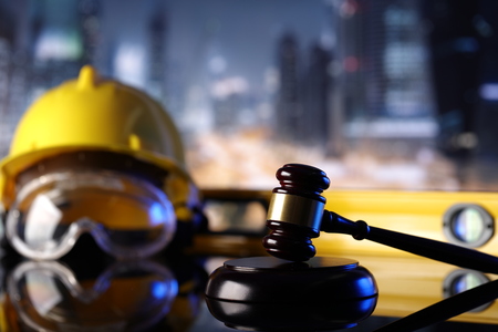 Law theme. Construction law's symbols  - helmet and gavel.の写真素材