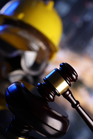 Law theme. Construction law's symbols  - helmet and gavel.の写真素材
