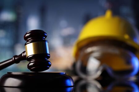 Law theme. Construction law's symbols  - helmet and gavel.の写真素材