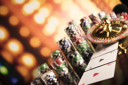 Casino thme. High contrast image of casino roulette, poker game, dice game, poker chips on a gaming...