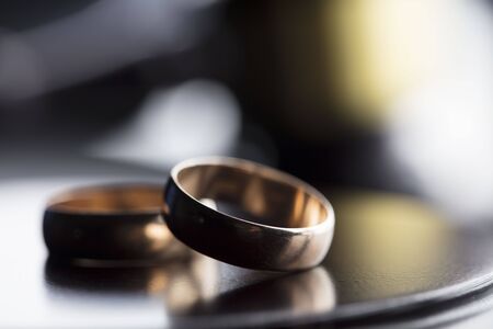 Divorce law concept. Wedding ring and gavel.の写真素材