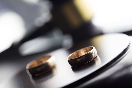 Divorce law concept. Wedding ring and gavel.の写真素材