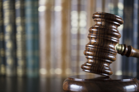 Court library - gavel of the judge and books.
