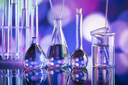 Laboratory concept. Beakers and test-tubes. Coloful bokeh background.の写真素材
