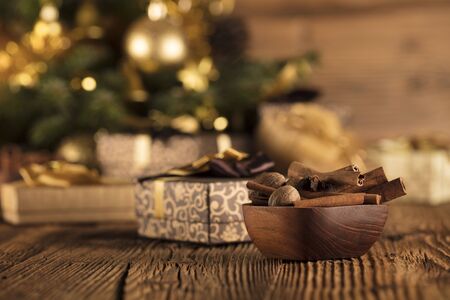 Christmas decoration and gifts on a rustic wooden background.の写真素材