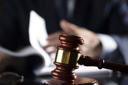 Judge signs the documents. Gavel. Law and justice theme.