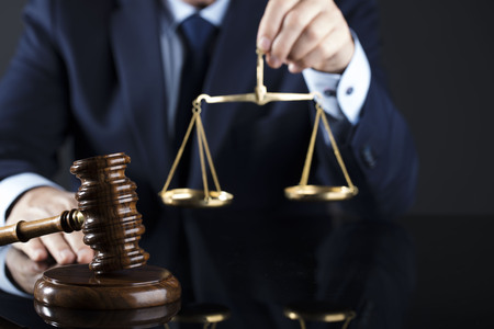 Judge signing the documents. Gavel. Law and justice theme.の写真素材