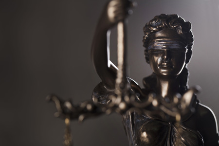 Courtroom concept. Themis â symbol of blind justice. Gray stone background.の写真素材