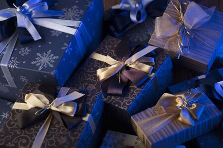 Gift giving concept. Presents on wooden table.