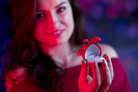Valentines day oncept. Pretty girl on colorful bokeh background.