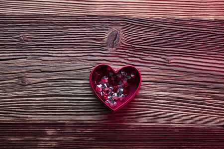 Valentines day background. Hearts, roses, gifts and romantic decorations  on rustic wooden table. Place for typography.の写真素材