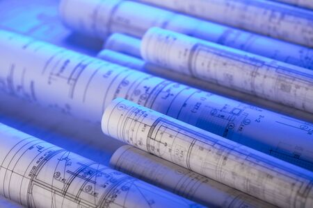 Workplace of architect. Rolls of blueprints. Place for text.の写真素材