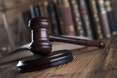 Law and justice concept. Law symbols on brown background.の写真素材