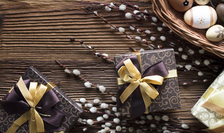 Happy Easter background. Presents and decorations. Easter eggs in basket.