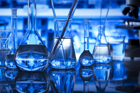 Science laboratory concept background. Microscope and laboratory glassware composition.の写真素材