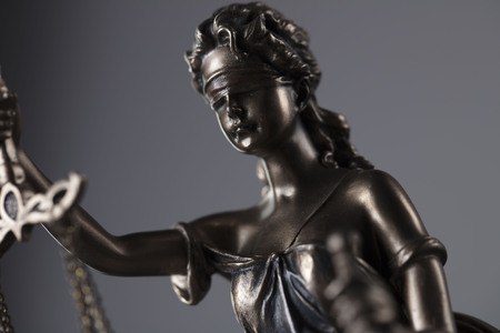 Law theme â statue of justice on gray background.の写真素材