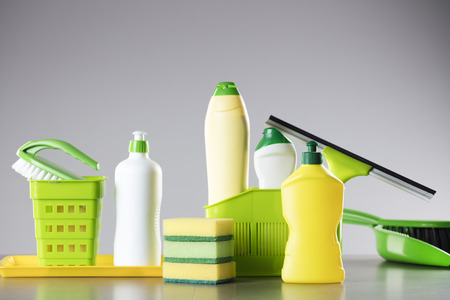 House and office cleaning up theme.  Set of colorful cleaning products on gray background.の写真素材