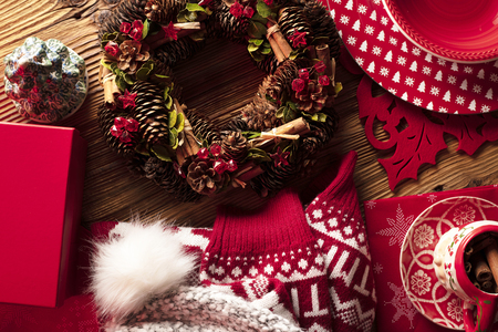 Christmas decorations, presents and tableware on wooden rustic table.の写真素材