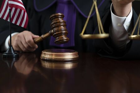 Judge with the wooden gavel in his hand. Law and justice theme.の写真素材