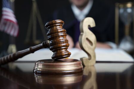 Judge with the wooden gavel in his hand. Law and justice theme.の写真素材