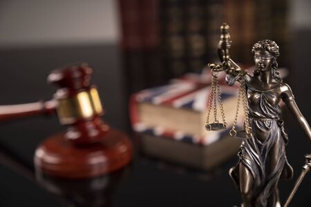 Statue of justice - Themis, legal codes and  gavel of the judge.の写真素材