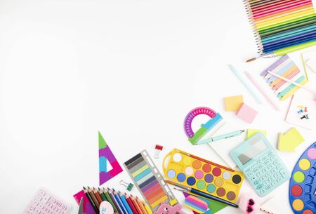 School supplies. Set of colorful school accessories isolated on the white table.の写真素材