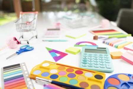 School supplies. Set of colorful school accessories isolated on the white table.の写真素材