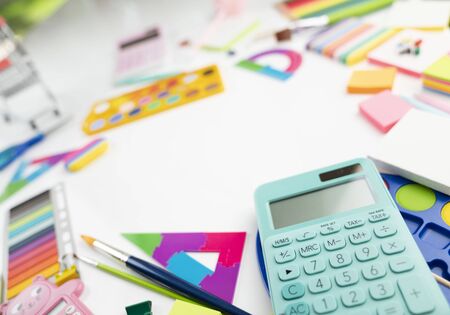 School supplies. Set of colorful school accessories isolated on the white table.の写真素材