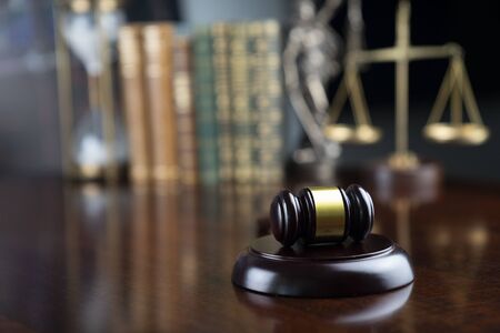 Law and justice theme, judgeâs gavel and the scale on court library background.の写真素材