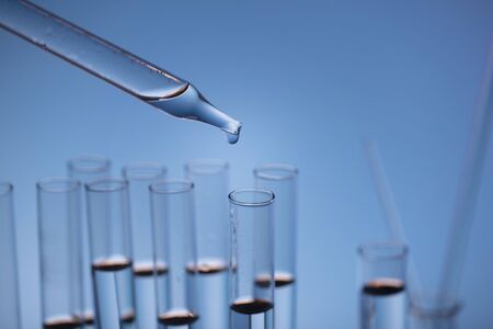 pandemic theme. Science research concerning fast covid tests and anti-covid vaccine. Beakers and...