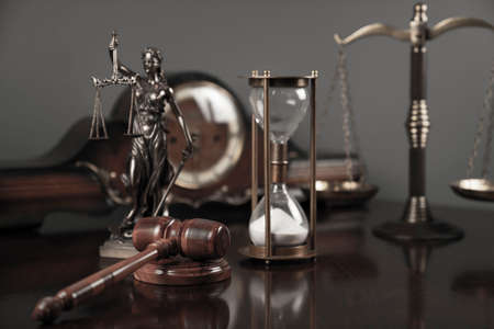 Lawyers office concept. Law symbols composition: Themis sculpture, gavel and scale.の写真素材