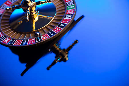 Casino theme, close up of roulette, red and black numbers. Blue background.の写真素材