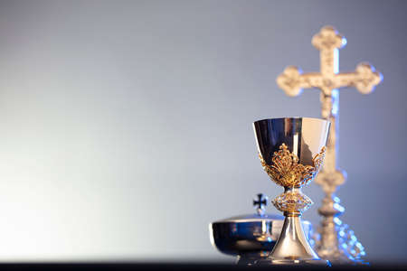 Religion theme â Easter. Catholic symbols composition. The Cross, monstrance  and golden chalice on blue background.の写真素材
