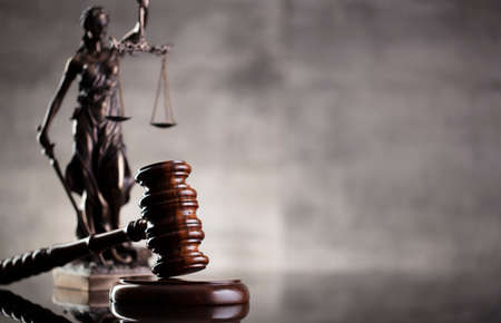Law and justice concept. Law symbols composition: judgeâs gavel, Themis  statue and scale. Gray background.の写真素材