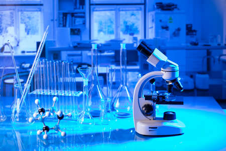 pandemic theme. Science research concerning fast tests and anti-vaccine. Microscope, beakers and test tubes in the scientific laboratory.の写真素材