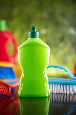 Spring house and office cleaning. Cleaning kit and sources on the glass table. Bokeh  background.の写真素材