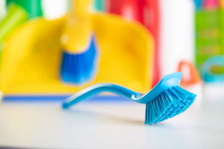 Summer cleaning. Colorful set of bottles with clining liquids and colorful cleaning kit on white background.の写真素材