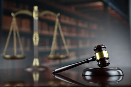 Law theme. Court library - gavel of the judge, scale and legal books.の写真素材