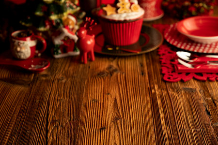 Christmas background. Christmas tableware and decorations on rustic wooden table.の写真素材
