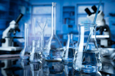 Laboratory investigations concerning test and medicine against covid. Microscope, glass tubes and...