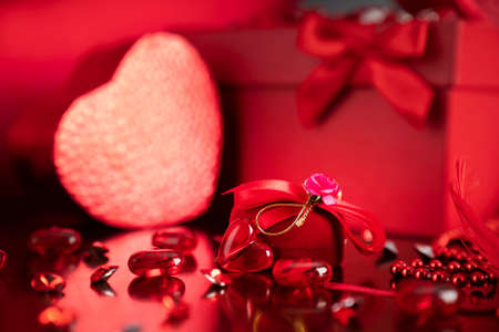 Valentines day concept. Red hearts,  boxes with valentines gifts and valentines decorations on the...