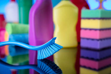 Sping cleaning. Cleaning products. Colorful cleaning kit on blue background.の写真素材