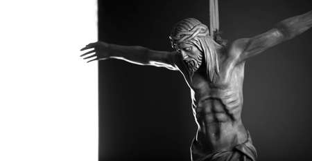 Religion theme - Jesus Christ. Cruciefied Jesus figure isolated on rustic dark background.の写真素材