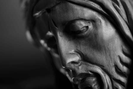 Religion theme - Jesus Christ. Cruciefied Jesus figure isolated on rustic dark background.の写真素材