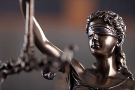 Law and justice concept. Justice symbol - Themis sculpture on gray background.の写真素材