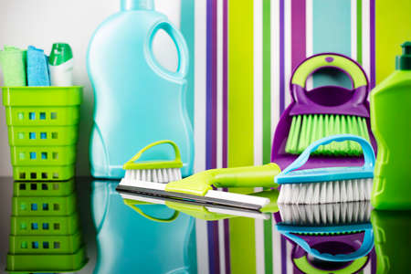 House  and office cleaning products. Colorful cleaning kit on striped color background.の写真素材