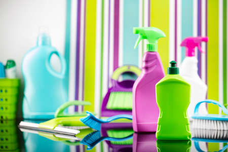 House  and office cleaning products. Colorful cleaning kit on striped color background.の写真素材